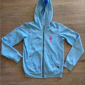 Aviator Nation Light Blue Zip Hoodie with Pink Lightning Bolt